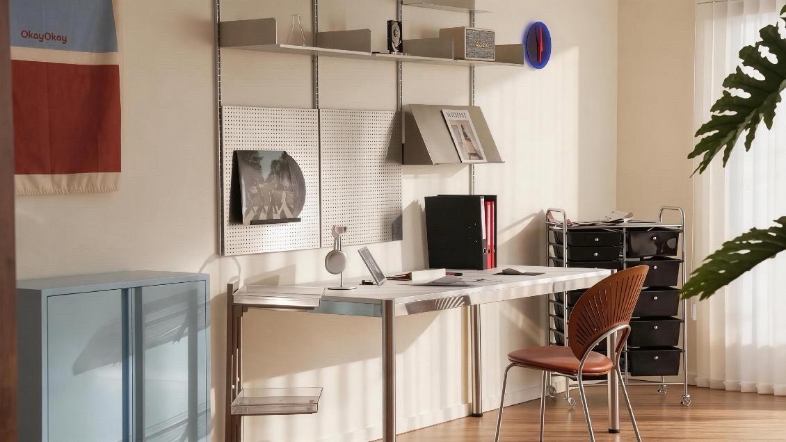 Studio workspace: pegboard wall and pale blue sideboard